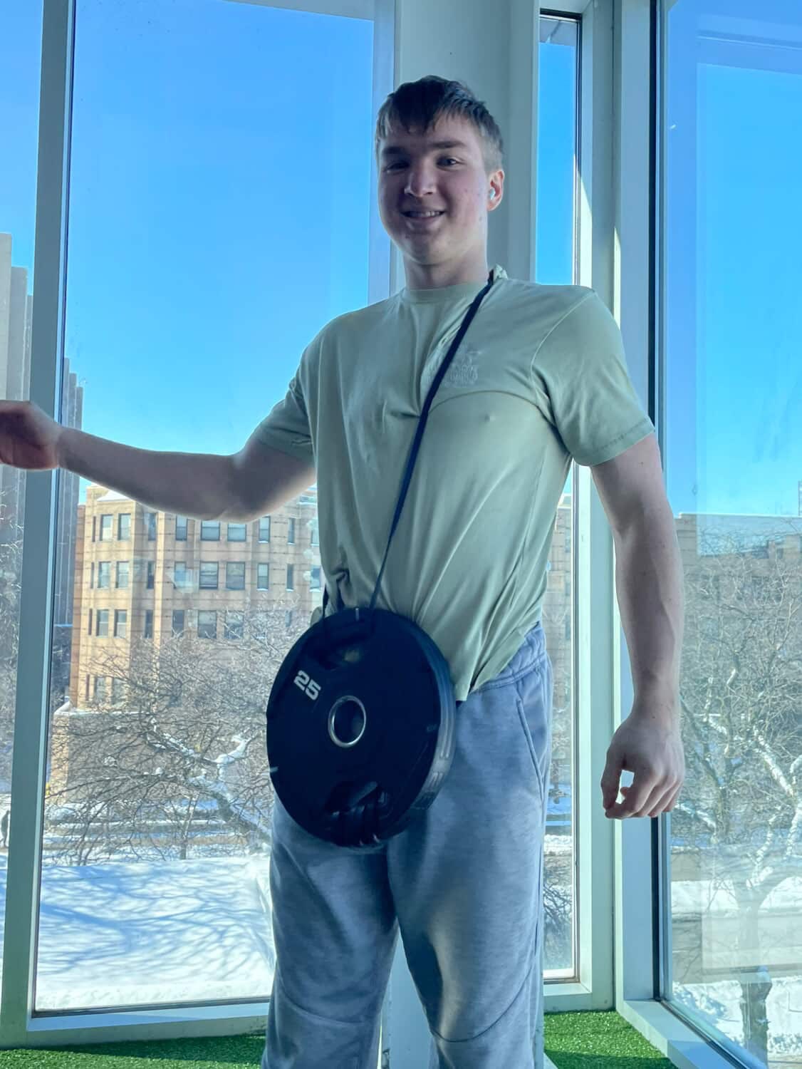David holding a weight plate after training