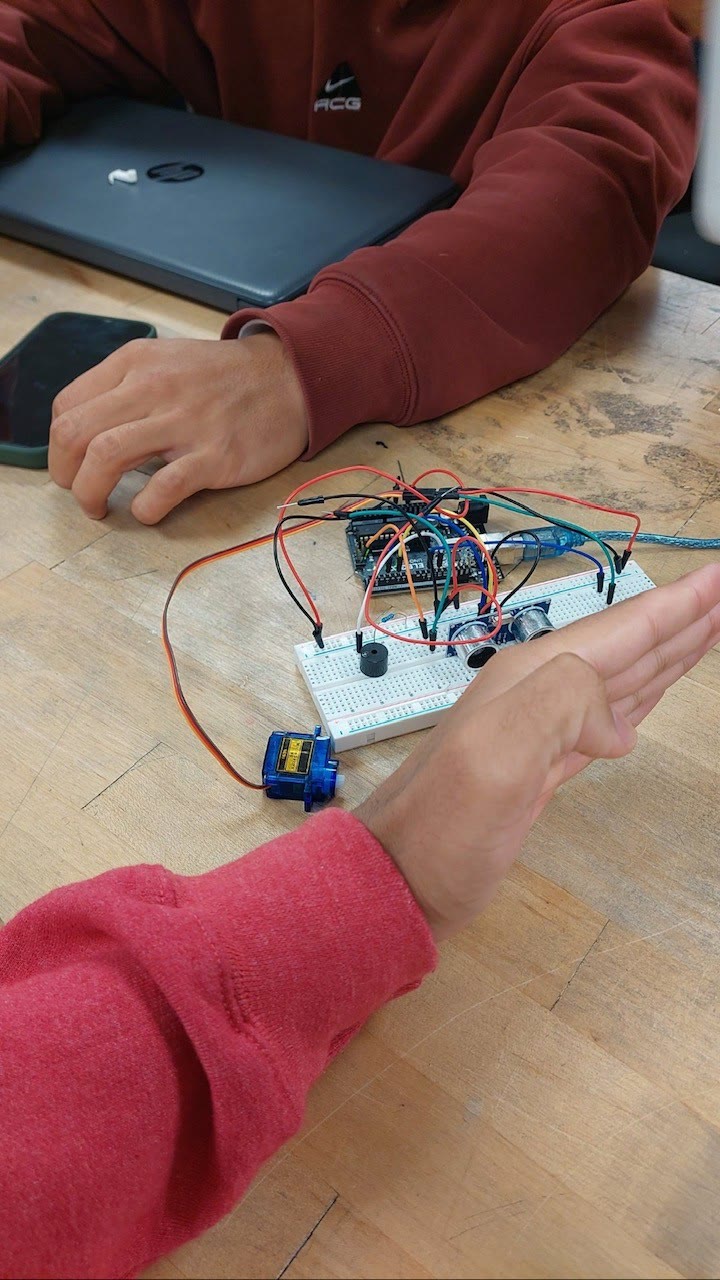 Arduino breadboard with ultrasonic sensor servo and buzzer